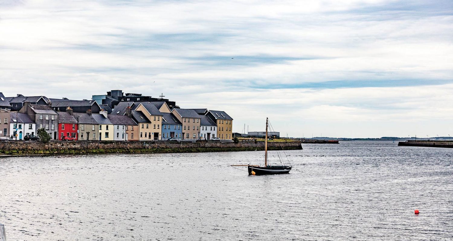 Photo of houses along river in Galway, Ireland