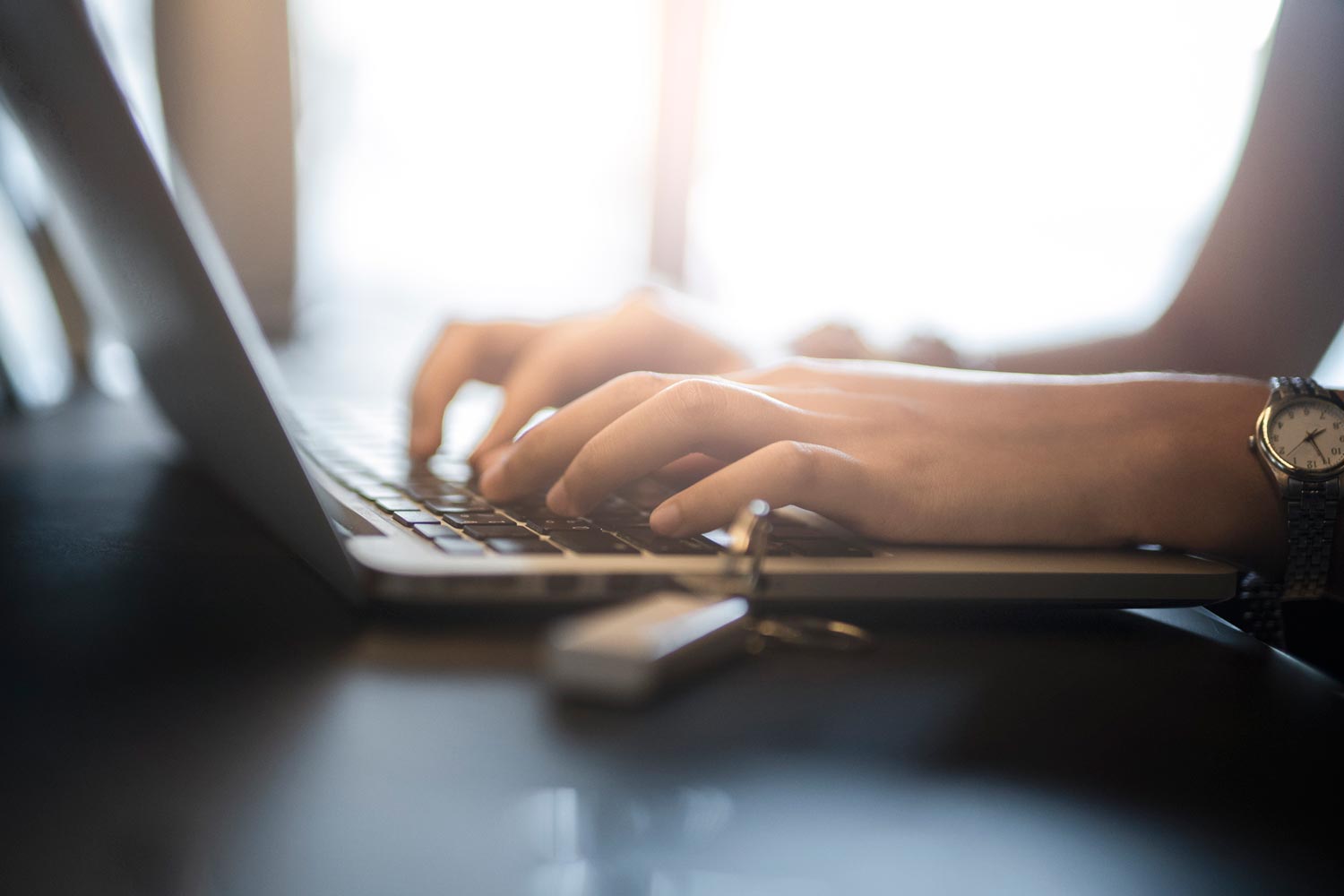 Woman using her laptop in a home office