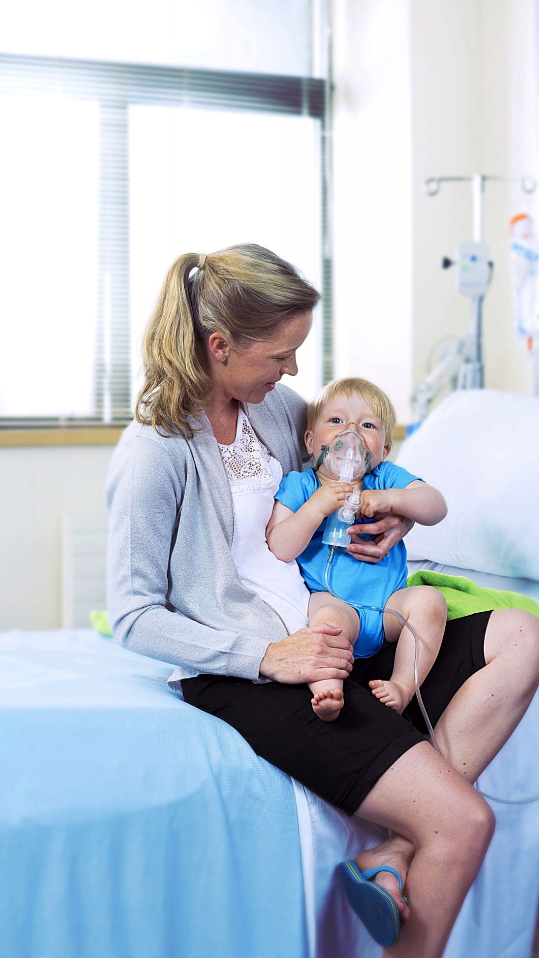 Mother holding baby with breathing mechanism in Irish Hospital