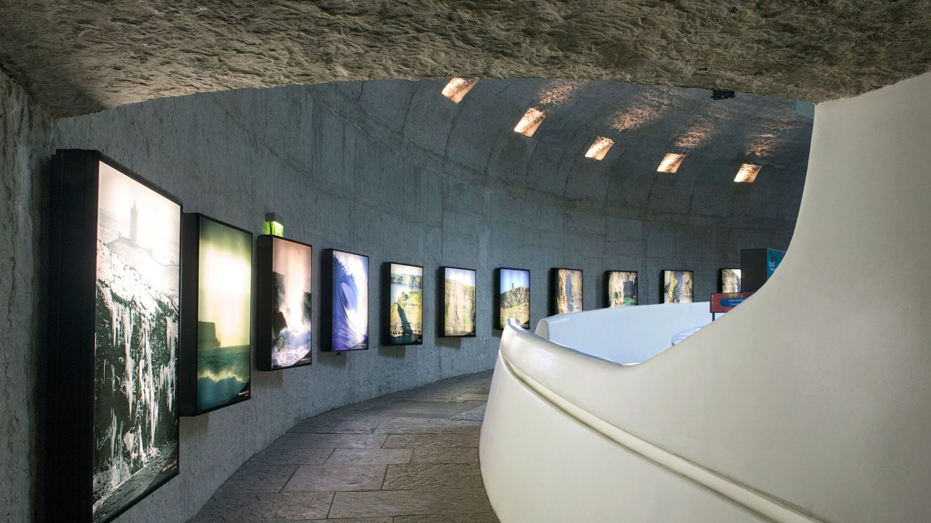 Walkway in the Cliffs of Moher Information Center with digital photography on screens