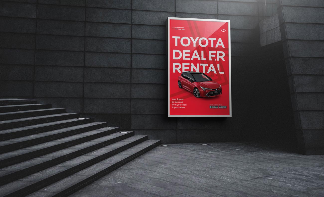 LED Screen in rail tunnel displaying digital poster advertisement for Toyota Dealer Rental