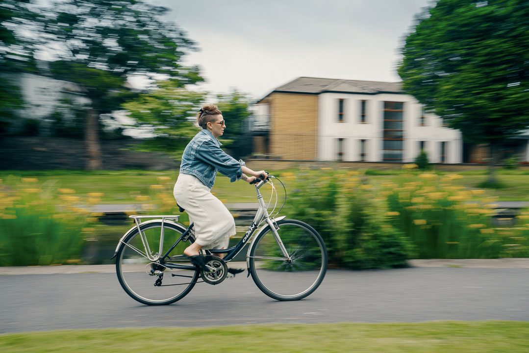 Photograph of woman riding bicycle in Dublin, Ireland